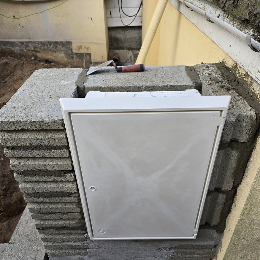 “Relocation of the electrical meter box to accommodate the new extension.”