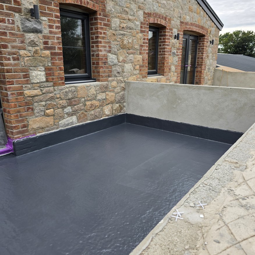 “Restec Flexitec applied to balconies, ready for slab installation.”