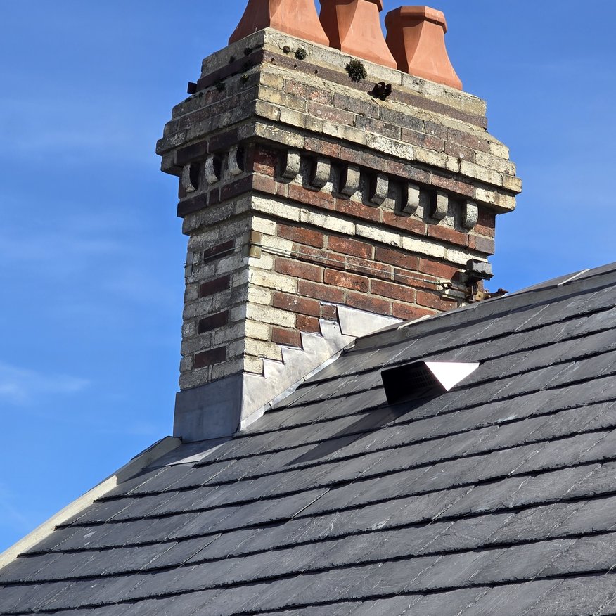 “Step lead flashing work carried out on this heritage chimney.”