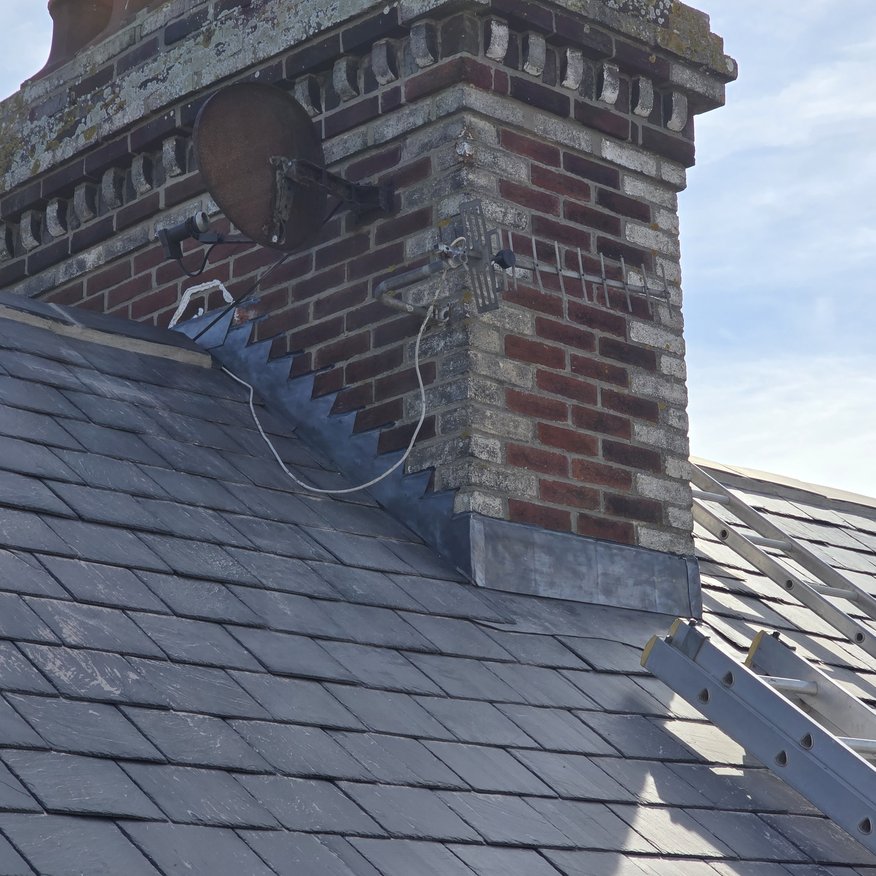 “Traditional step lead flashing carefully installed on this heritage chimney.”