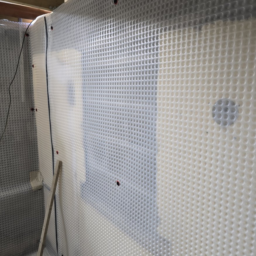 “Tanking system applied for effective damp management.”