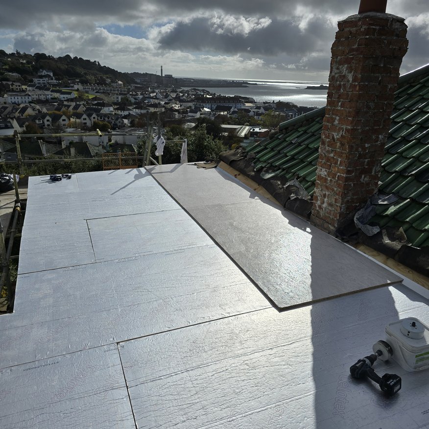 “Upgrade from a cold flat roof to a warm roof system, incorporating 5-inch insulation and 18 mm OSB3 decking.”