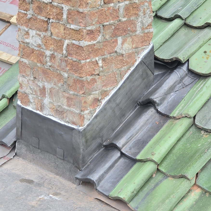 “Precision-installed lead soakers and flashings, seamlessly integrated with the Restec Platinum roofing system.”